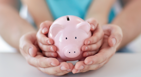 child holding piggy bank