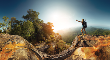 hiker prasing the sun