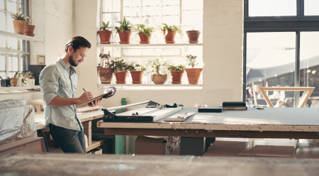 Craftsman writing on clipboard